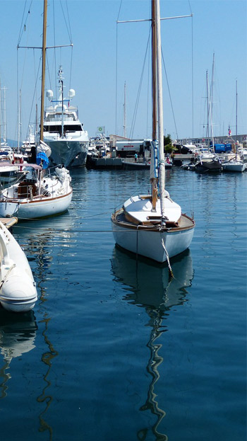 mariner with boats sitting in water